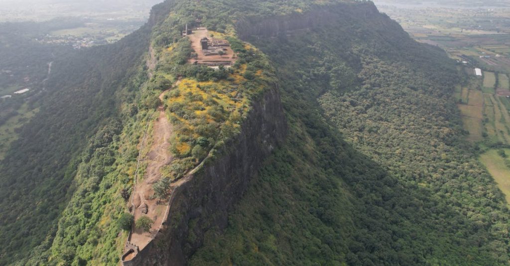 Best Resorts in Mahad: Your Complete Guide to a Perfect Weekend Getaway Stunning aerial shot of a historic fort on a lush hill in Maharashtra, India.